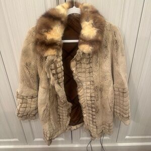 Raccoon fur coat comes with matching fur belt. Size 42. Made in Greece.